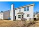 Two-story house featuring a backyard patio and chimney at 4160 Alveston Dr, Atlanta, GA 30349