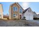 Two-story house with stone accents and a two-car garage at 4160 Alveston Dr, Atlanta, GA 30349