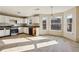 Bright kitchen with white cabinets and stainless steel appliances at 4160 Alveston Dr, Atlanta, GA 30349