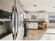 Stainless steel refrigerator in a kitchen with white cabinets and tile floor at 4160 Alveston Dr, Atlanta, GA 30349