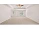 Spacious bedroom with tray ceiling, ceiling fan and natural light, perfect for relaxation at 13520 Whitman Lane, Covington, GA 30014