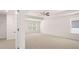 Large primary bedroom with natural light, neutral carpet and a tray ceiling at 13520 Whitman Lane, Covington, GA 30014
