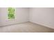 Bedroom with carpet, window letting in natural light, and neutral walls at 13520 Whitman Lane, Covington, GA 30014