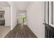 Inviting foyer with hardwood floors, neutral walls, and easy access to the kitchen at 13520 Whitman Lane, Covington, GA 30014