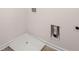 Laundry area with washer/dryer hookups and a white shower pan at 13520 Whitman Lane, Covington, GA 30014