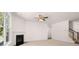 A well-lit living room features neutral carpeting and a modern fireplace at 13520 Whitman Lane, Covington, GA 30014