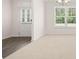 Bright and spacious living room featuring neutral decor, carpet floors, and lots of sunlight at 13520 Whitman Lane, Covington, GA 30014