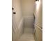 Clean, painted basement with carpeted stairs at 1800 Pinedale Nw Dr, Atlanta, GA 30314