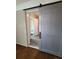 View of bathroom through a barn door at 1800 Pinedale Nw Dr, Atlanta, GA 30314
