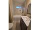 Modern bathroom with a shower, vanity, and marble tile at 1800 Pinedale Nw Dr, Atlanta, GA 30314