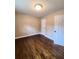 Well-lit bedroom with hardwood floors and spacious closet at 1800 Pinedale Nw Dr, Atlanta, GA 30314