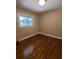 Bright bedroom with hardwood floors and large window at 1800 Pinedale Nw Dr, Atlanta, GA 30314