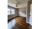 Bedroom with hardwood floors, ceiling fan, and large windows at 1800 Pinedale Nw Dr, Atlanta, GA 30314
