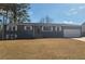 Newly renovated house with gray exterior and attached garage at 1800 Pinedale Nw Dr, Atlanta, GA 30314