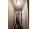 Hallway with dark hardwood floors and neutral walls, leading to bedrooms at 1800 Pinedale Nw Dr, Atlanta, GA 30314