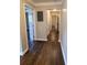 Hallway with dark hardwood floors and neutral walls at 1800 Pinedale Nw Dr, Atlanta, GA 30314