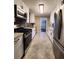 Modern kitchen with white cabinets, stainless steel appliances, and tile flooring at 1800 Pinedale Nw Dr, Atlanta, GA 30314