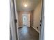 Laundry room with tile floors and adjacent bathroom at 1800 Pinedale Nw Dr, Atlanta, GA 30314