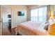 King-size bed in main bedroom with city view at 361 17Th St # 2001, Atlanta, GA 30363