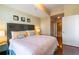 King-size bed, hardwood floors, and ensuite bathroom at 361 17Th St # 2001, Atlanta, GA 30363