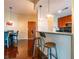 Small dining area with dark wood table and chairs near kitchen at 361 17Th St # 2001, Atlanta, GA 30363