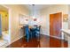 Small dining area with dark wood table and chairs near kitchen at 361 17Th St # 2001, Atlanta, GA 30363