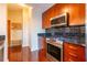 Modern kitchen with stainless steel appliances and dark wood cabinets at 361 17Th St # 2001, Atlanta, GA 30363