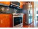 Modern kitchen with stainless steel appliances and dark wood cabinets at 361 17Th St # 2001, Atlanta, GA 30363