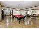 Spacious basement recreation room with pool table and seating area at 1891 Prospect Church Rd, Lawrenceville, GA 30043