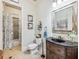 Elegant bathroom with dark vanity, shower, and toilet at 1891 Prospect Church Rd, Lawrenceville, GA 30043