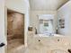 Elegant bathroom with soaking tub, walk-in shower, and mosaic tile floor at 1891 Prospect Church Rd, Lawrenceville, GA 30043