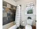 Clean bathroom with shower/tub combo, tile surround, and window at 1891 Prospect Church Rd, Lawrenceville, GA 30043