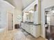 Spa-like bathroom with double vanity, granite countertop, and large mirror at 1891 Prospect Church Rd, Lawrenceville, GA 30043