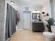 Bathroom with shower/tub combo, vanity, and toilet at 1891 Prospect Church Rd, Lawrenceville, GA 30043