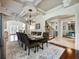 Spacious dining room with hardwood floors, chandelier, and access to other rooms at 1891 Prospect Church Rd, Lawrenceville, GA 30043