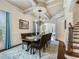 Formal dining room with a large table, chandelier, and hardwood floors at 1891 Prospect Church Rd, Lawrenceville, GA 30043