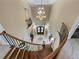 Grand two-story entryway with curved staircase and chandelier at 1891 Prospect Church Rd, Lawrenceville, GA 30043
