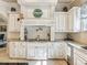 Bright kitchen with granite countertops, custom cabinetry, and cooktop at 1891 Prospect Church Rd, Lawrenceville, GA 30043