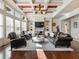 Sunlit living room with hardwood floors, fireplace, and built-in shelving at 1891 Prospect Church Rd, Lawrenceville, GA 30043