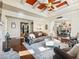 Open concept living room with hardwood floors and views to kitchen and dining area at 1891 Prospect Church Rd, Lawrenceville, GA 30043