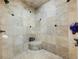 Large walk-in shower with beige tile and built-in seat at 1891 Prospect Church Rd, Lawrenceville, GA 30043