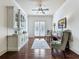 Bright sitting room with built-in cabinetry, hardwood floors, and French doors at 1891 Prospect Church Rd, Lawrenceville, GA 30043