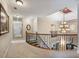 Elegant upper hall with chandelier and carpet at 1891 Prospect Church Rd, Lawrenceville, GA 30043