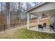 Covered patio with wooded backyard and privacy fence at 66 Vicky Way, Douglasville, GA 30134