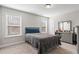 Cozy bedroom with a full-size bed and a dresser at 66 Vicky Way, Douglasville, GA 30134