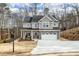 Two-story house with gray siding, stone accents, and a two-car garage at 66 Vicky Way, Douglasville, GA 30134