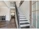 Elegant staircase with dark wood and metal railing leading to the second floor at 66 Vicky Way, Douglasville, GA 30134
