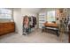 Cozy bedroom featuring a clothing rack, built-in shelves, and dresser at 44 Browns Ct, Powder Springs, GA 30127