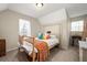 Bright bedroom with carpeted floor and a comfortable bed at 44 Browns Ct, Powder Springs, GA 30127