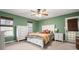 Bedroom with a white dresser, bed, and green walls at 44 Browns Ct, Powder Springs, GA 30127